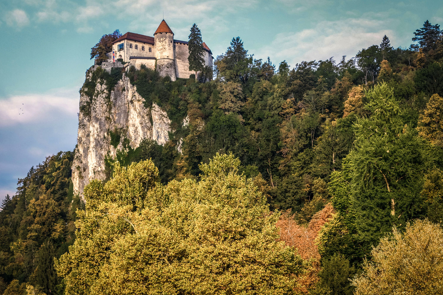 Bled Castle atop the cliff above Lake Bled. 