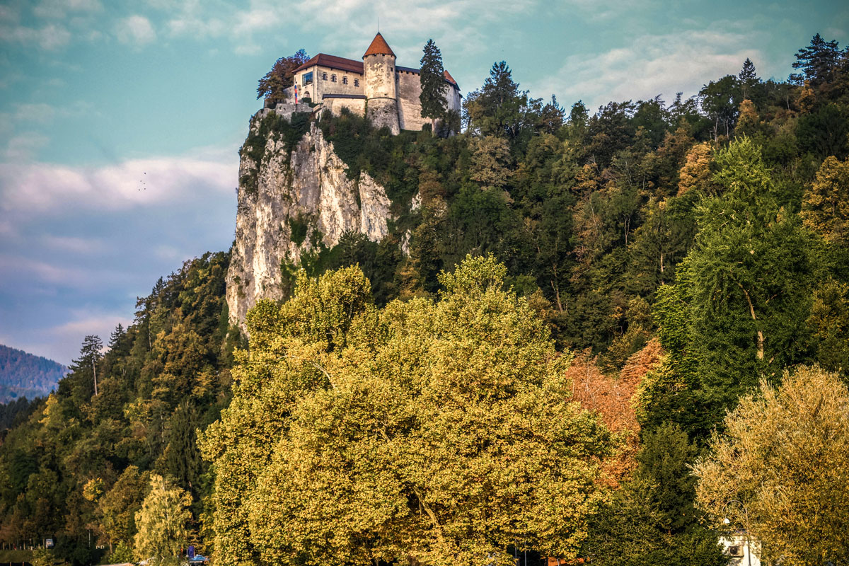 Bled Castle atop the cliff above Lake Bled.