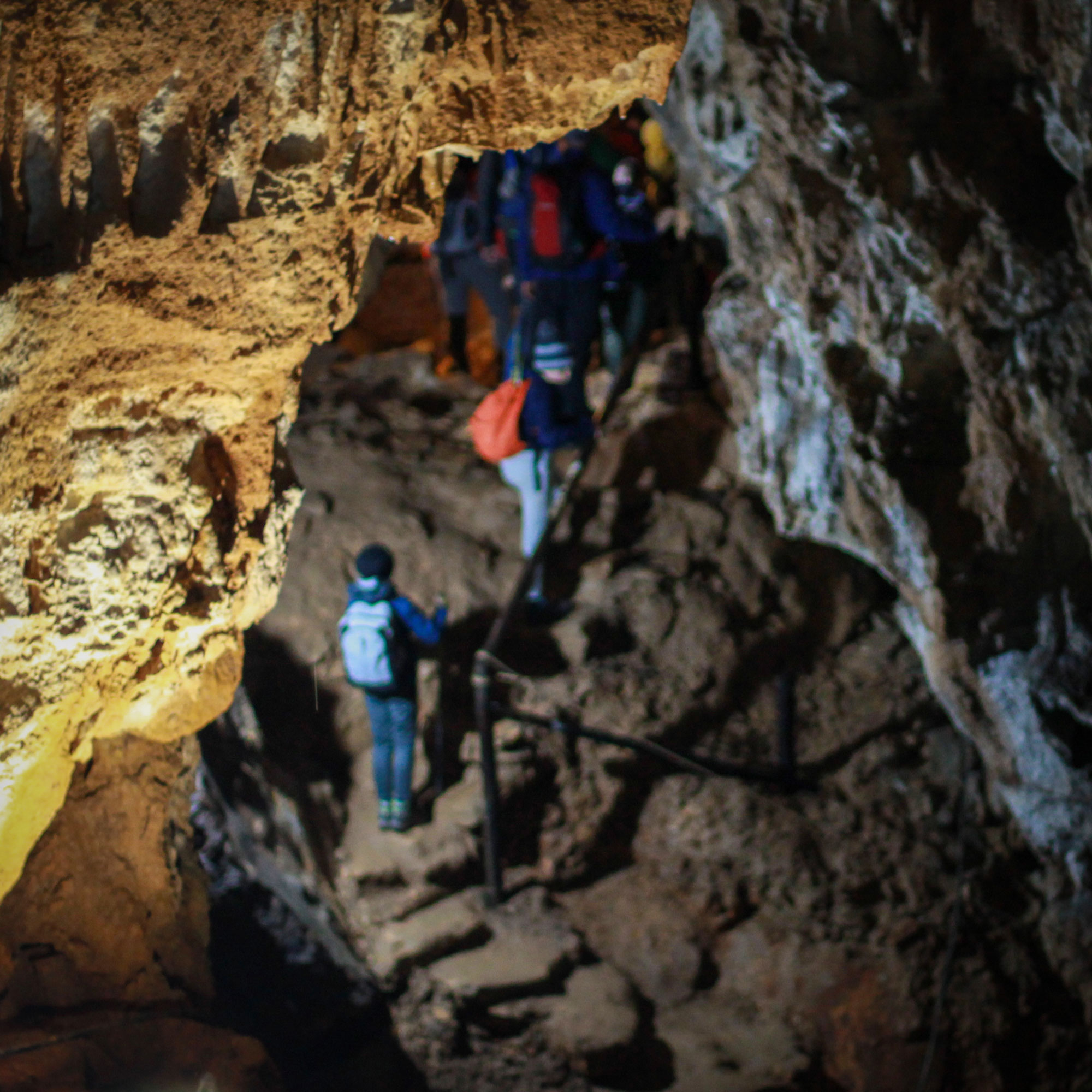 Explore a hidden cave beneath a tooth-shaped rock