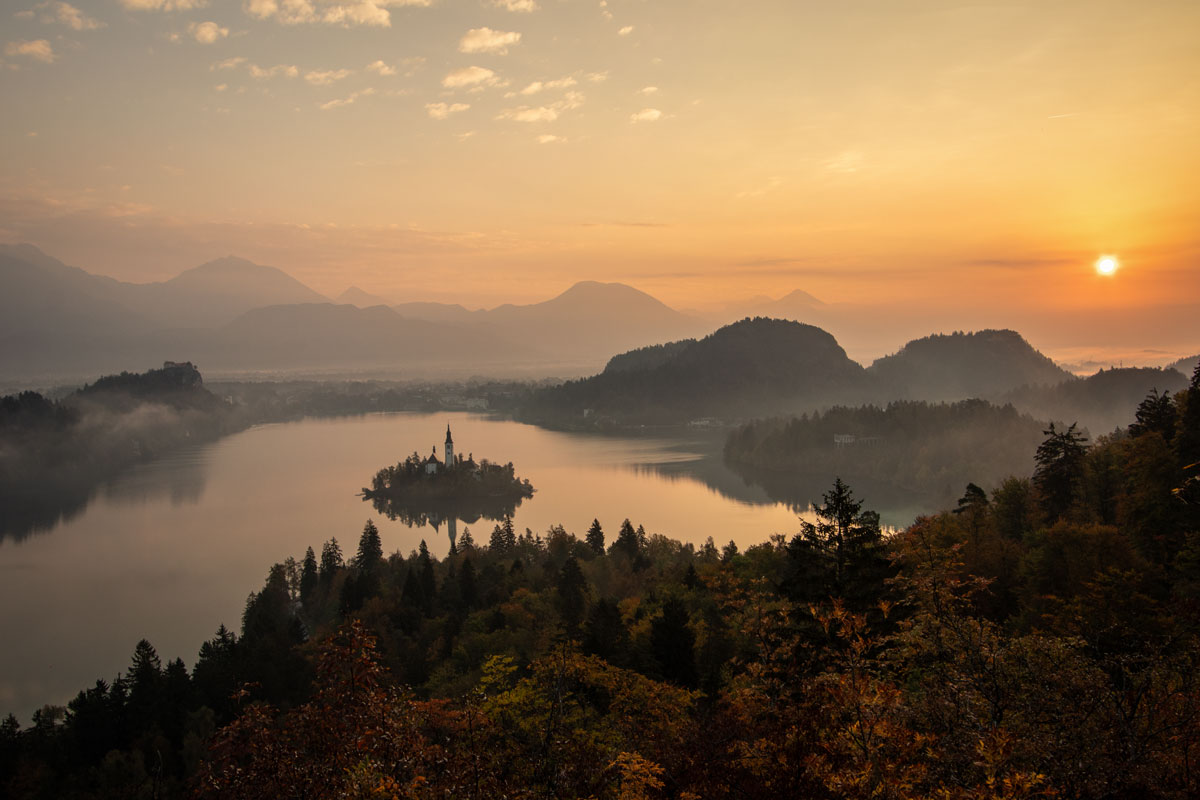 Early morning view from the Ojstrica viewpoint above Lake Bled in Slovenia in autumn. 